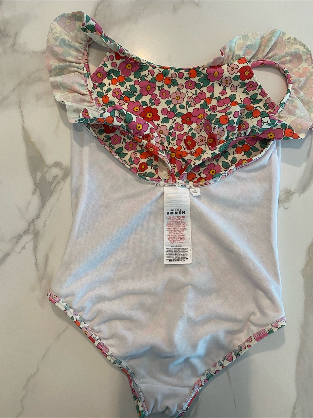 Mini Boden Frill Strap one piece swimsuit floral w/off white background - Picture 3 of 5